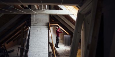 Person renovating an attic space